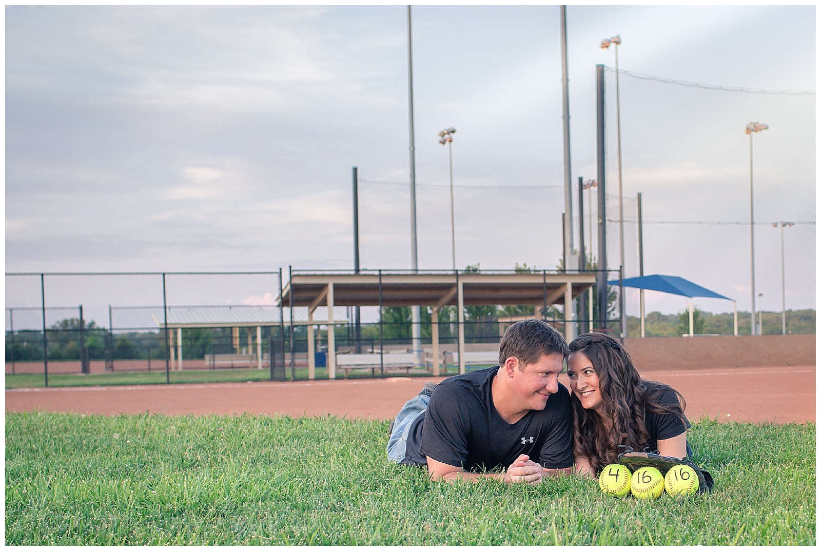 An engagement session at a softball field in Topeka, Kansas.