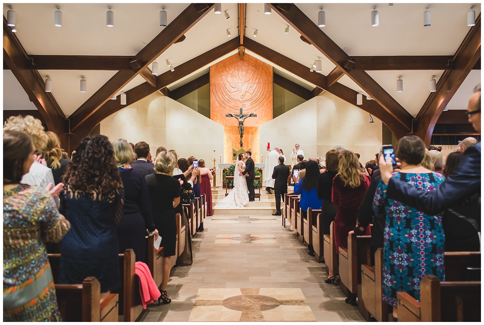 Wedding photography at Holy Spirit Catholic Church in Overland Park by Kansas City wedding photographers Wisdom-Watson Weddings.