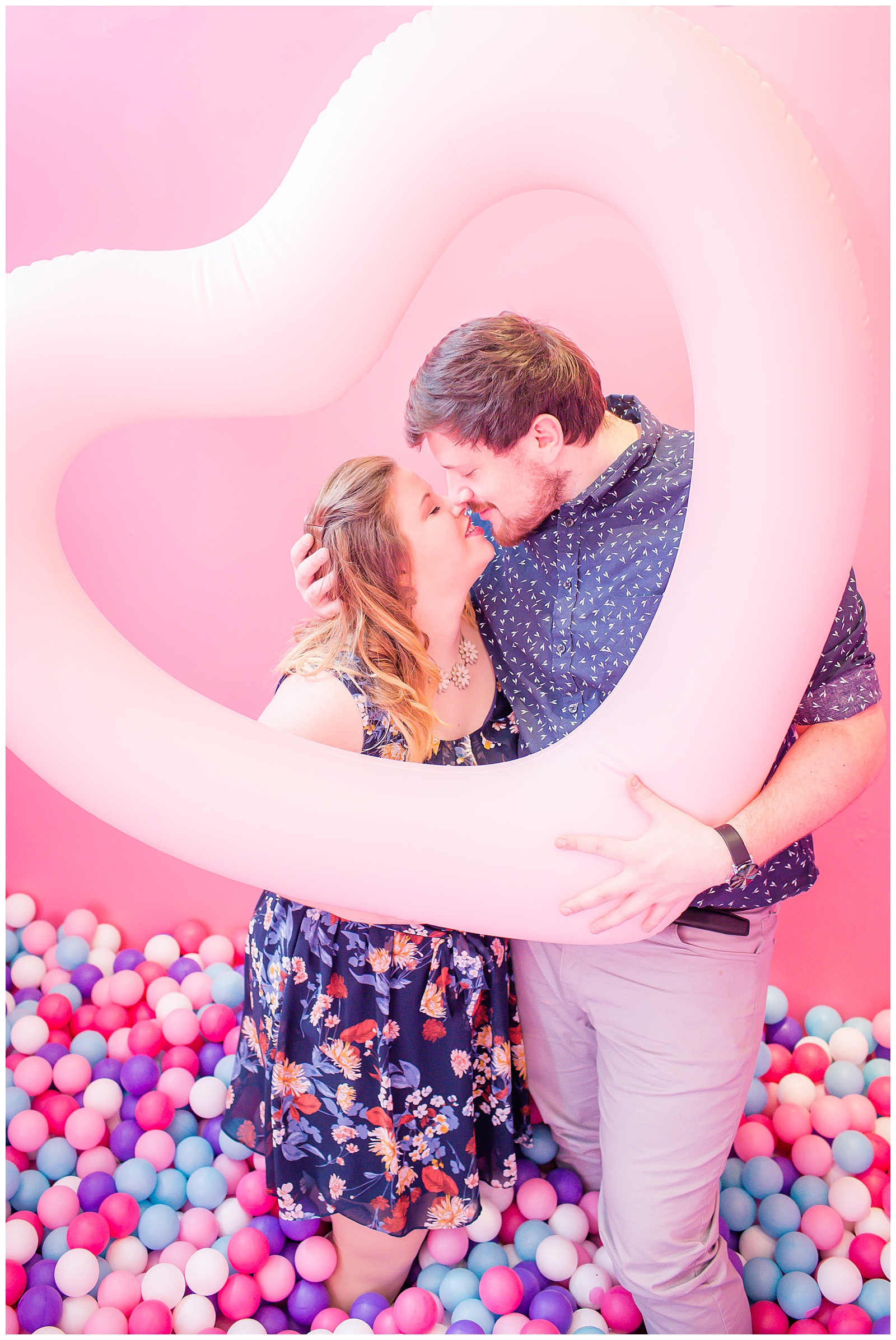 Engagement photography at the Museum of Good Vibes in Kansas City by wedding photographers Wisdom-Watson Weddings.