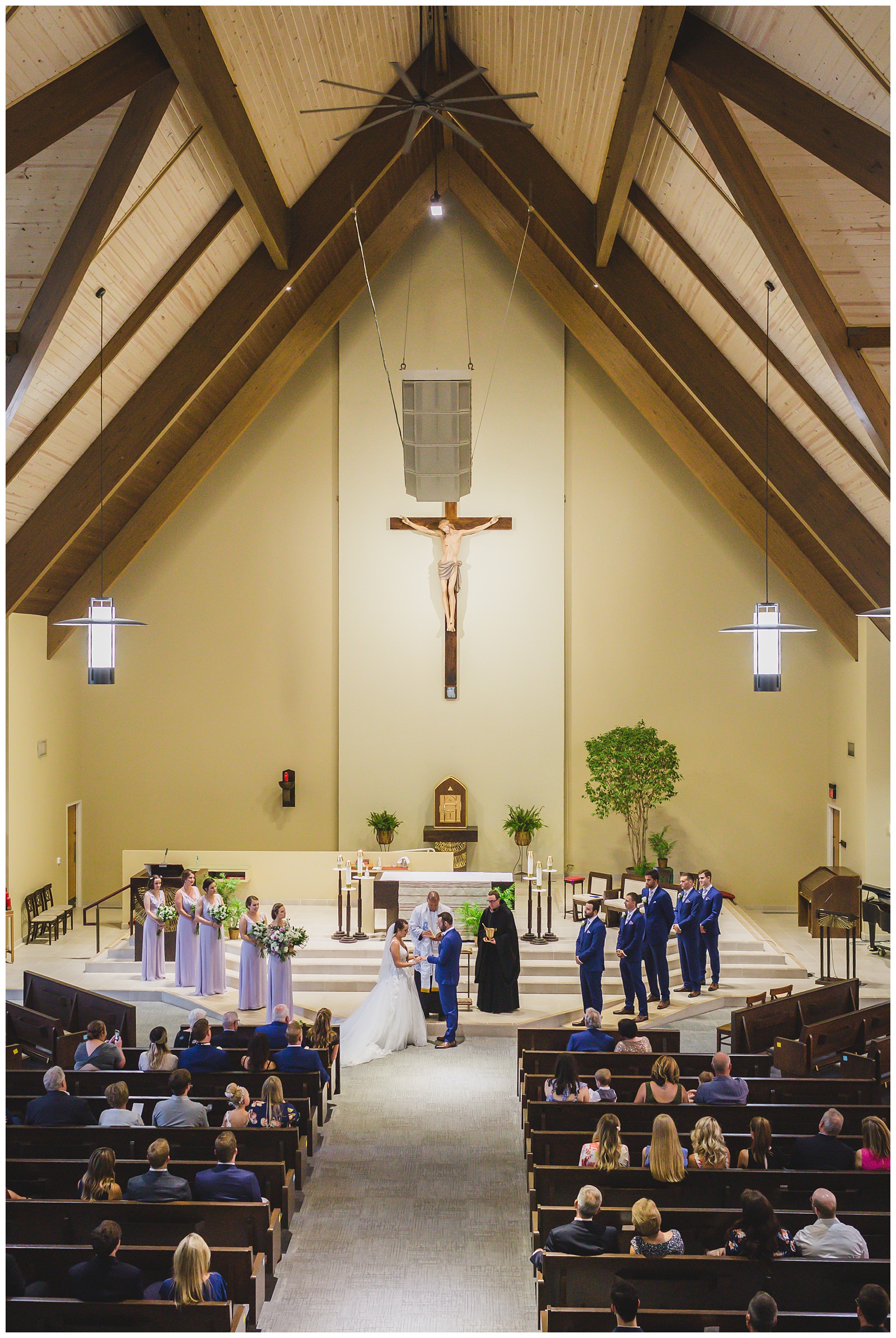 Wedding photography at St. Thomas More Catholic Church by Kansas City wedding photographers Wisdom-Watson Weddings.