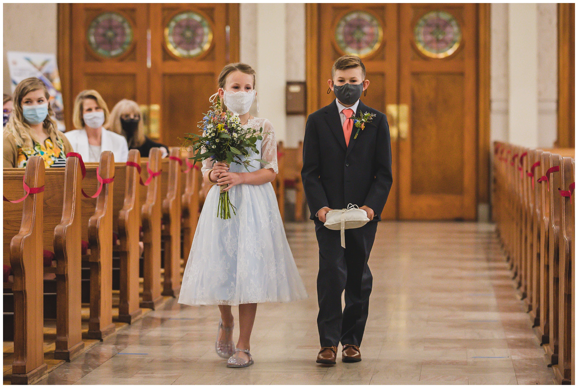 Wedding photography at Our Lady of Sorrows Catholic Church by Kansas City wedding photographers Wisdom-Watson Weddings.