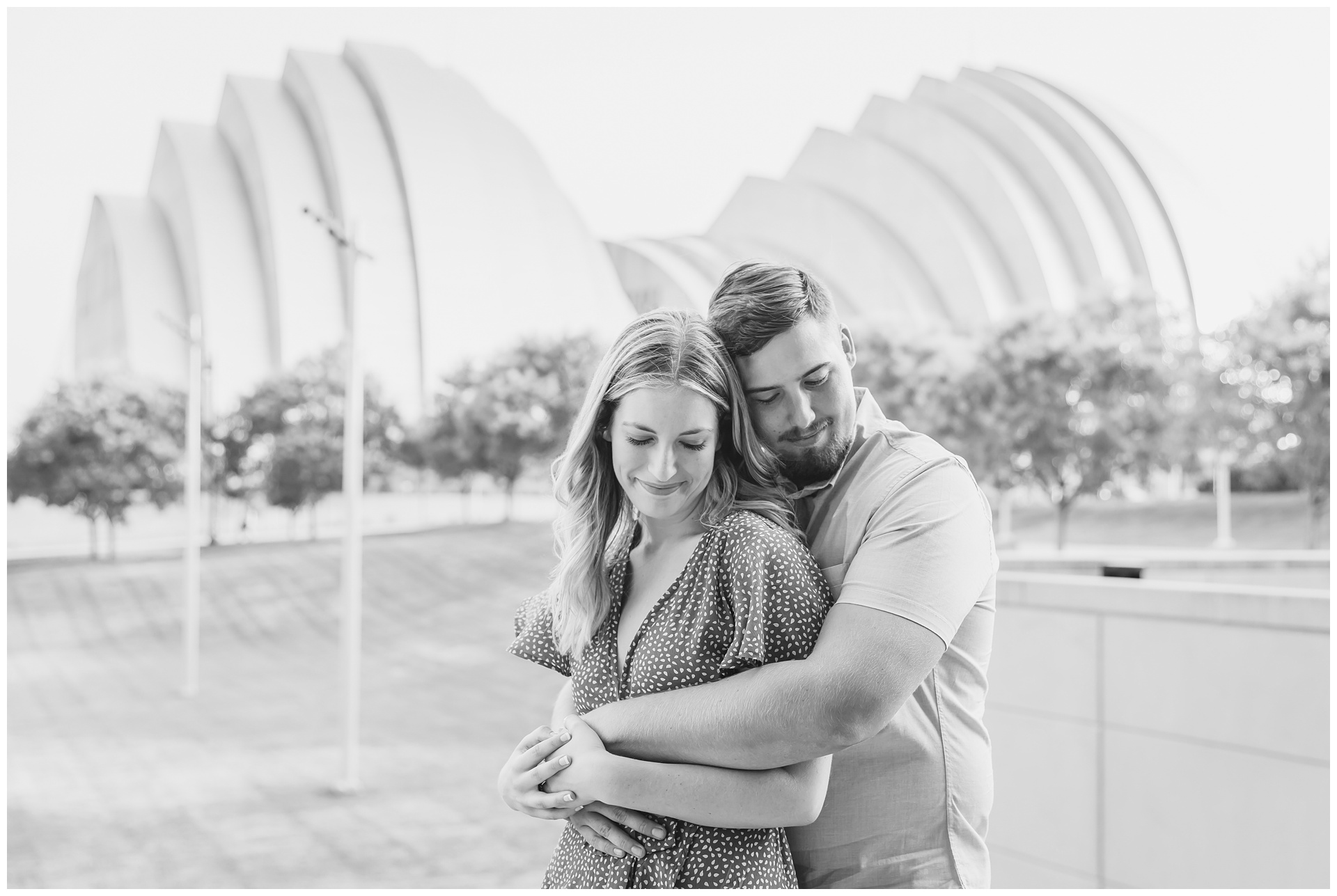 Engagement photography at the Kauffman Center and Penn Valley Park by Kansas City wedding photographers Wisdom-Watson Weddings.